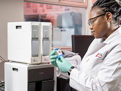 Female researcher testing samples in lab